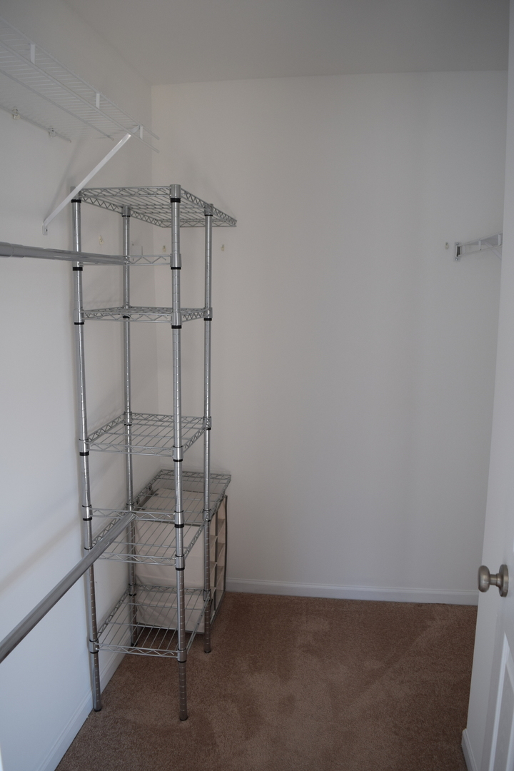 4110 Bethlehem Road Aurora, IL 60504 - Photo 33 of 53 a room with a chair and white walls