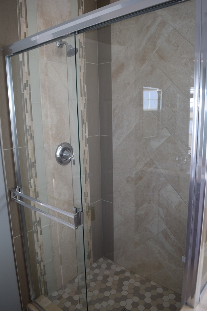 4110 Bethlehem Road Aurora, IL 60504 - Photo 35 of 53 a bathroom with a glass door shower