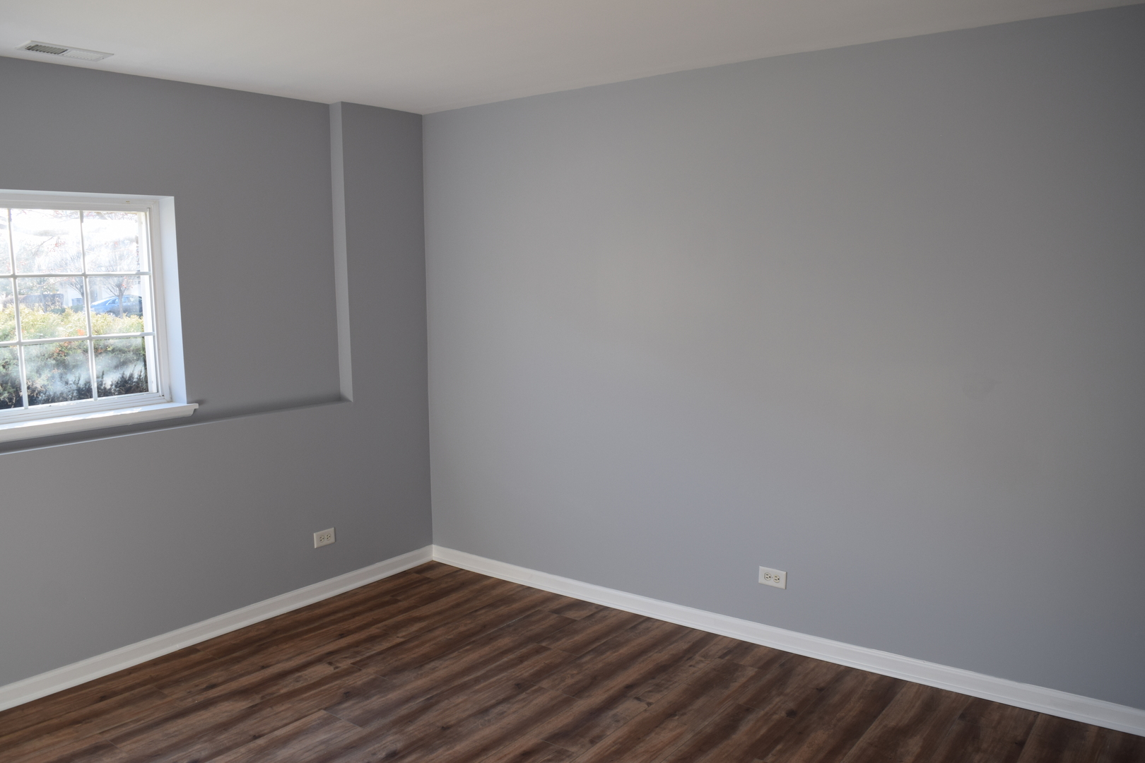 4110 Bethlehem Road Aurora, IL 60504 - Photo 53 of 53 a view of an empty room with wooden floor and a window
