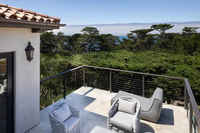 a spacious bathroom with a granite countertop sink and a mirror