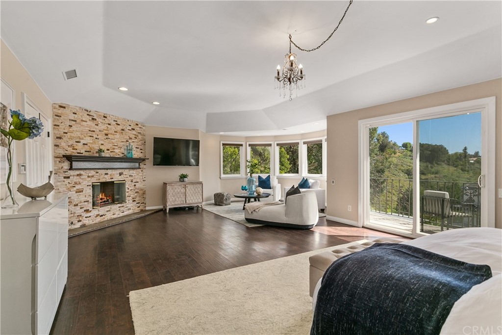 10282 Ambervale Lane North Tustin, CA 92705 - Photo 20 of 50 a living room with fireplace furniture and a flat screen tv