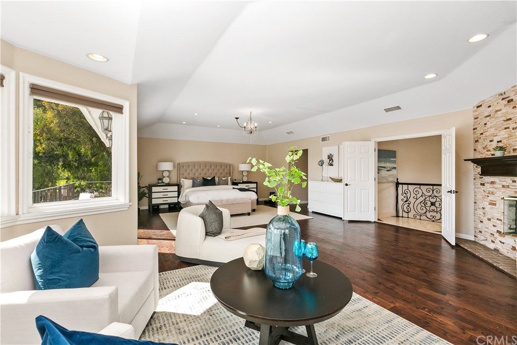 10282 Ambervale Lane North Tustin, CA 92705 - Photo 23 of 50 a living room with furniture potted plant and a wooden floor