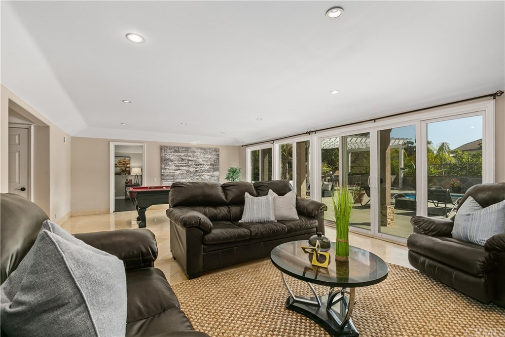 10282 Ambervale Lane North Tustin, CA 92705 - Photo 31 of 50 a living room with furniture and a large window