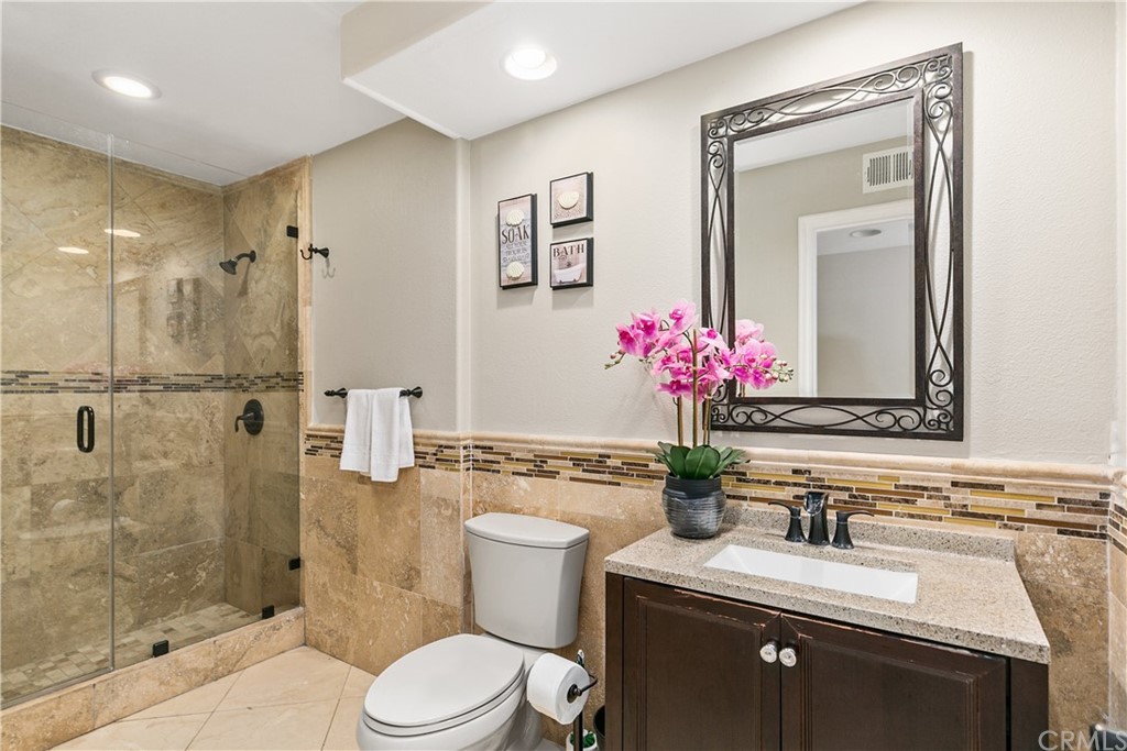 10282 Ambervale Lane North Tustin, CA 92705 - Photo 38 of 50 a bathroom with a sink vanity mirror and toilet