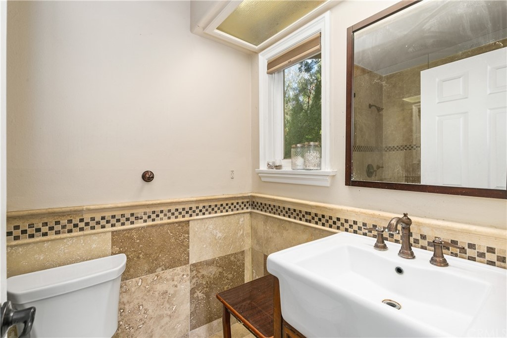 10282 Ambervale Lane North Tustin, CA 92705 - Photo 40 of 50 a bathroom with a sink and a toilet