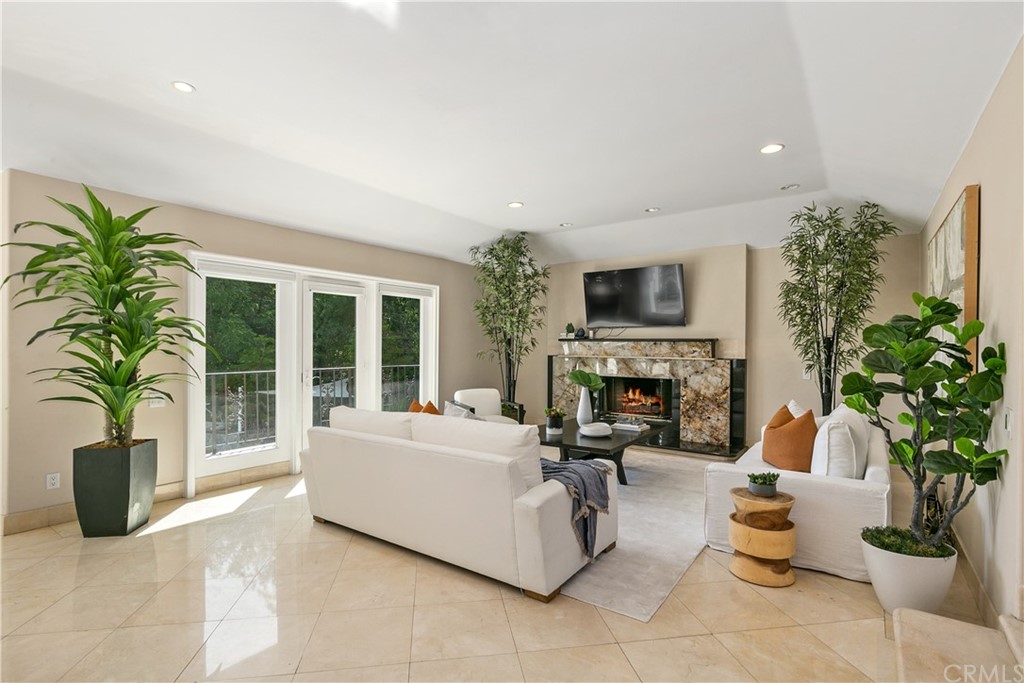 10282 Ambervale Lane North Tustin, CA 92705 - Photo 9 of 50 a living room with furniture potted plant and a fireplace