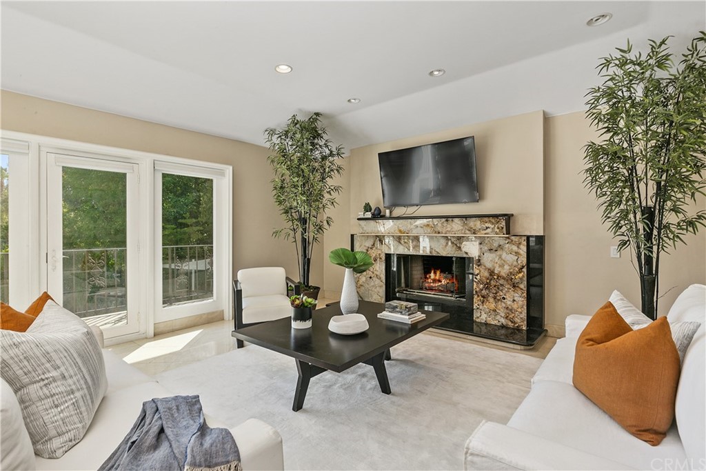 10282 Ambervale Lane North Tustin, CA 92705 - Photo 10 of 50 a living room with furniture a fireplace and a large window