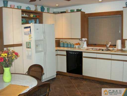 1049 Canal Road Princeton, NJ 08540 - Photo 1 of 6 a kitchen with a refrigerator and table chair