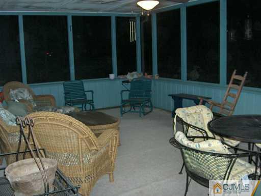 1049 Canal Road Princeton, NJ 08540 - Photo 5 of 6 a balcony with table and chairs