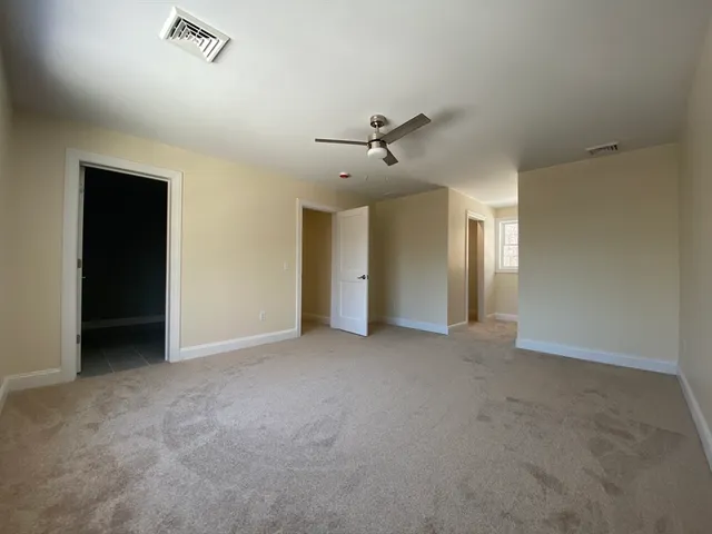a bathroom with a sink vanity and a toilet