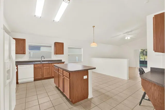 a kitchen with a sink a counter top space and appliances