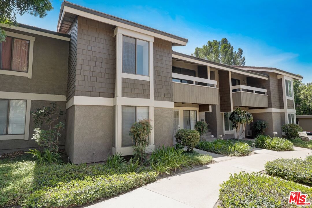 234 Springview Irvine, CA 92620 - Photo 1 of 19 a front view of a house with garden