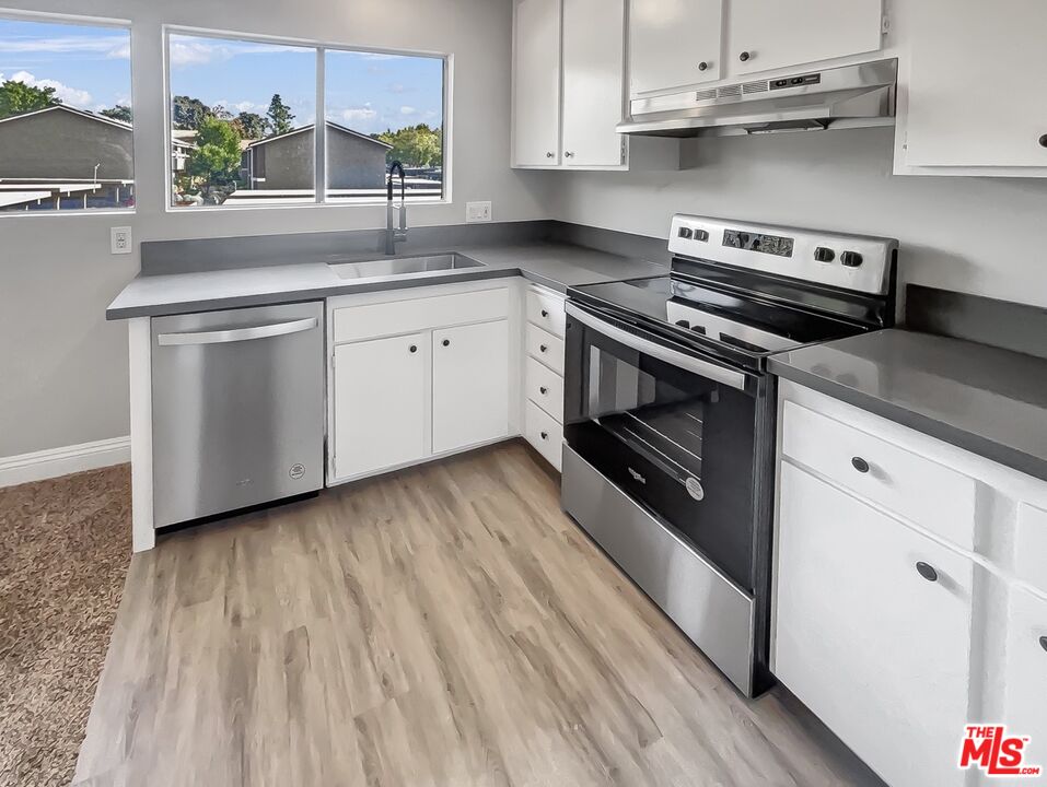 234 Springview Irvine, CA 92620 - Photo 12 of 19 a kitchen with a stove oven and sink