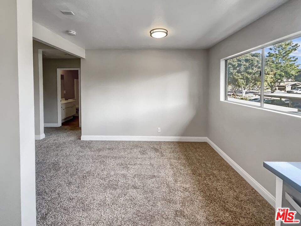 234 Springview Irvine, CA 92620 - Photo 13 of 19 an empty room with a empty space and windows