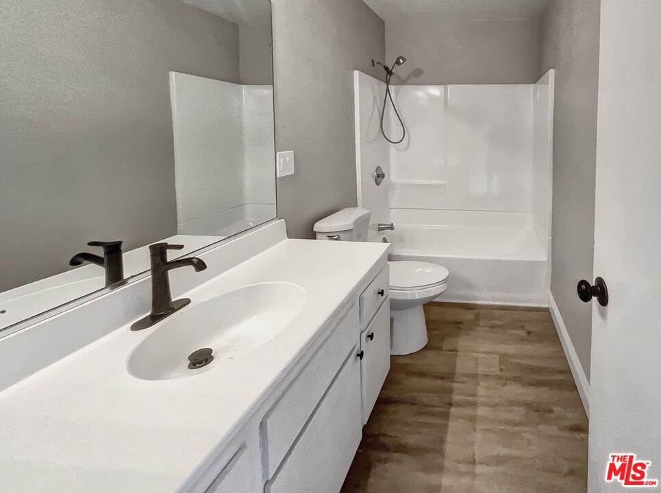 234 Springview Irvine, CA 92620 - Photo 14 of 19 a bathroom with a sink a toilet and shower