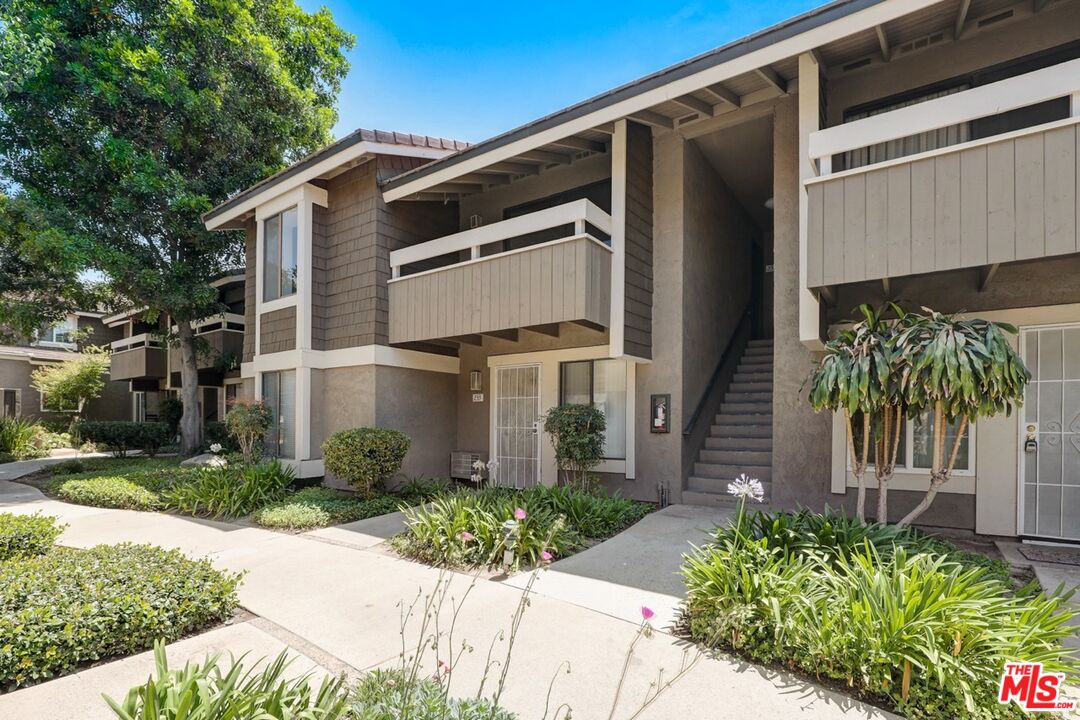 234 Springview Irvine, CA 92620 - Photo 16 of 19 a front view of a house with a yard