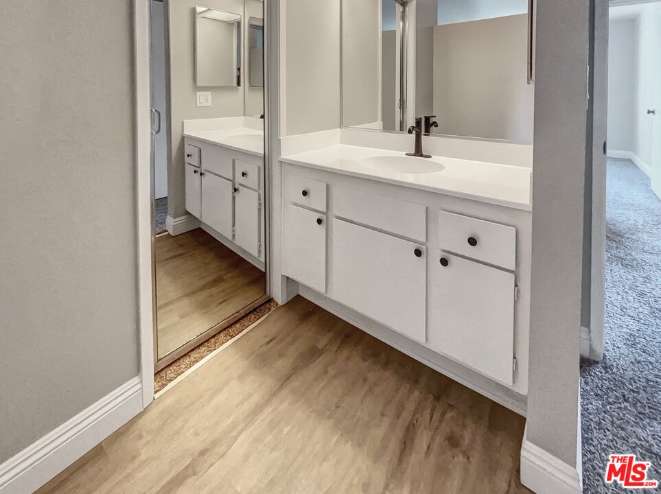 234 Springview Irvine, CA 92620 - Photo 17 of 19 a bathroom with double vanity sink and a mirror