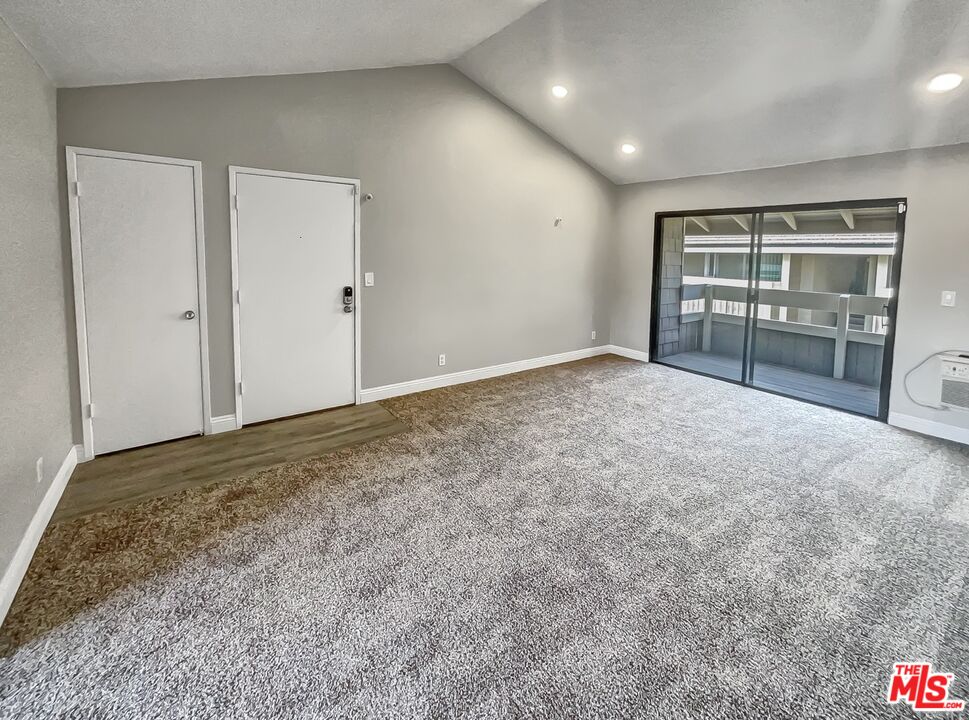 234 Springview Irvine, CA 92620 - Photo 19 of 19 an empty room with a fireplace and cabinet