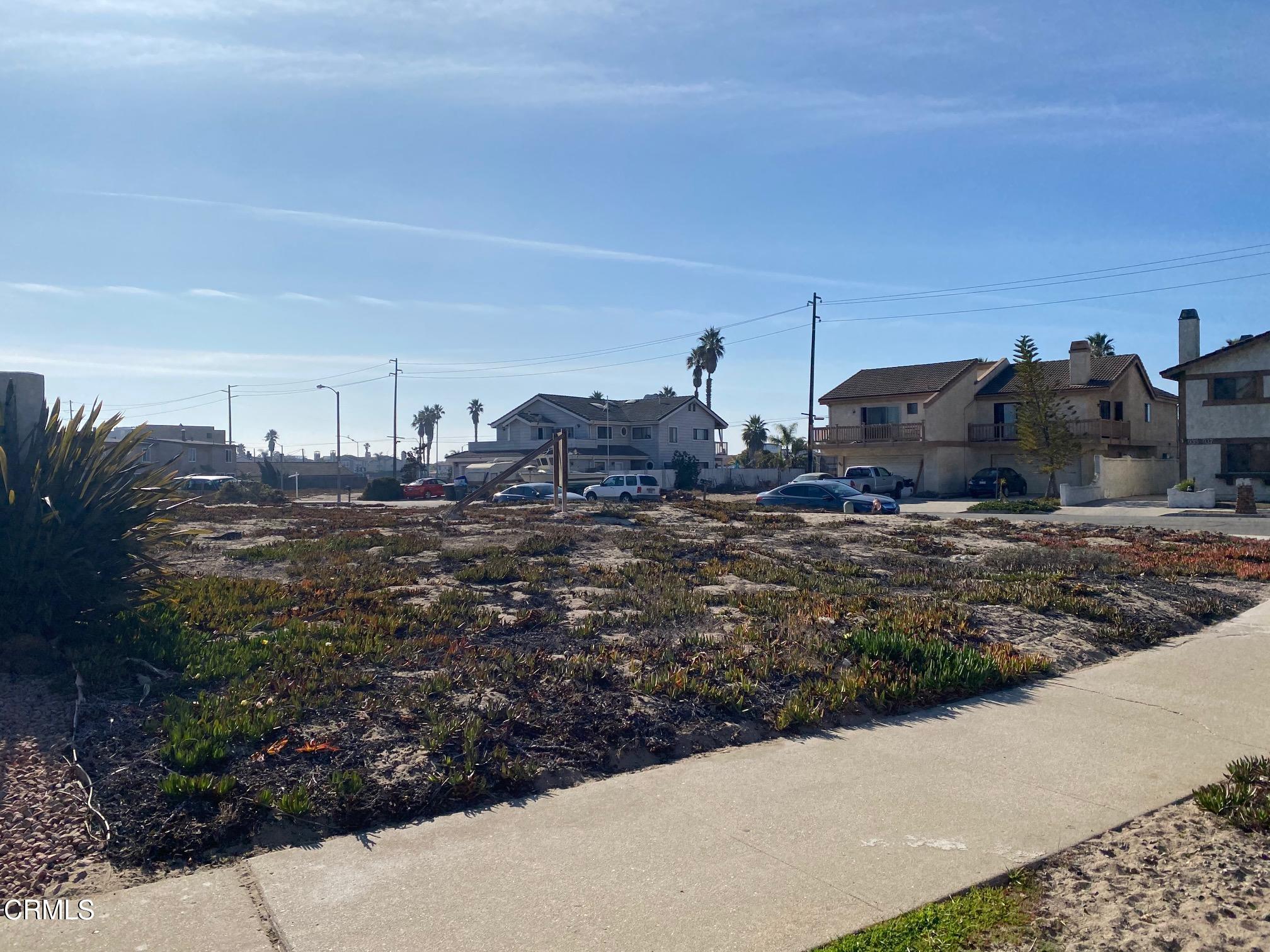 940 Dunes Street Oxnard, CA 93035 - Photo 3 of 6 a view of a dry yard with wooden fence