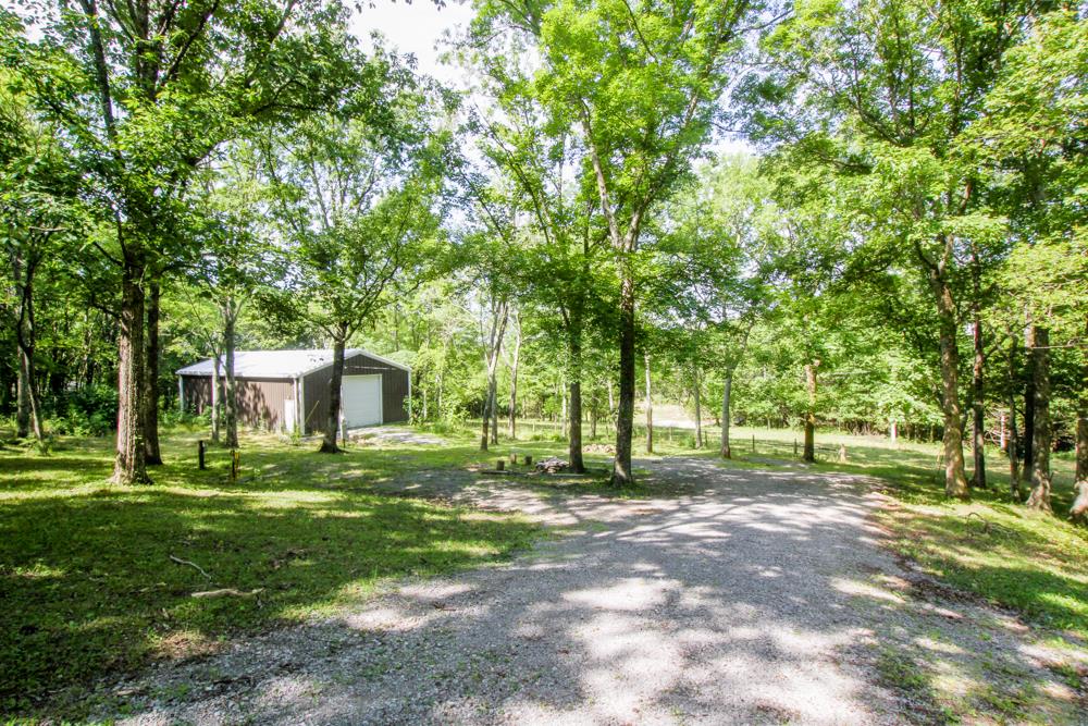 185 Osborne Road Watertown, TN 37184 - Photo 2 of 19 a backyard of a house with table and chairs