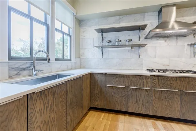 a kitchen with a sink and a window