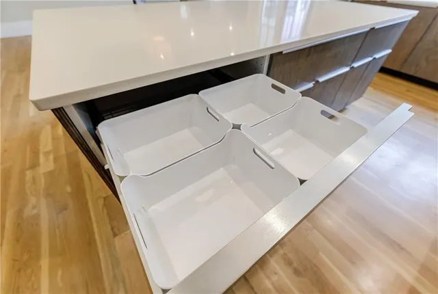 a view of a storage & utility room with two washing machine
