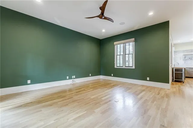 swimming pool view with a seating space