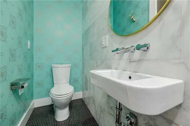 a bathroom with a sink a mirror and bathtub