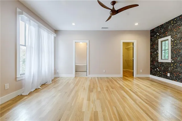 a bathroom with a bathtub and double sink