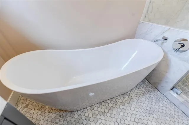 a bathroom with a toilet and shower