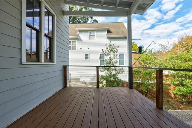 a view of balcony with wooden floor
