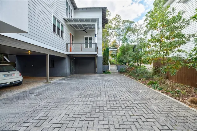 a view of a car park in front of house