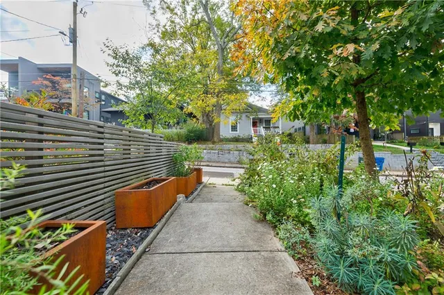 a view of a pathway both side of house