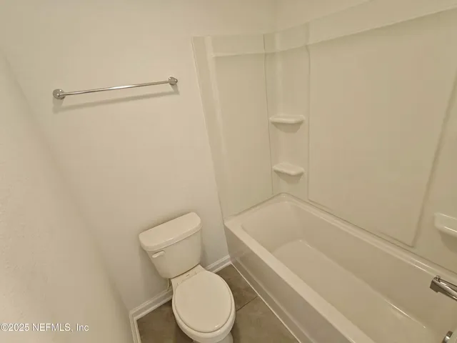 a view of yard with swimming pool and green space