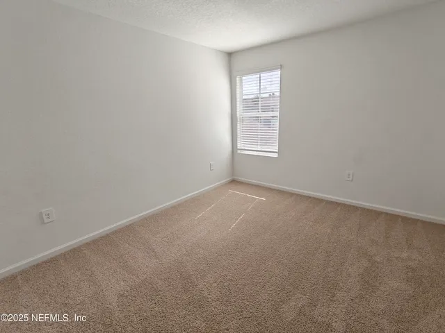a bed sitting in front of a house