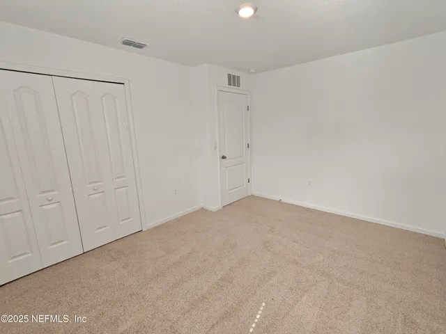 a view of a golf course with a lake view