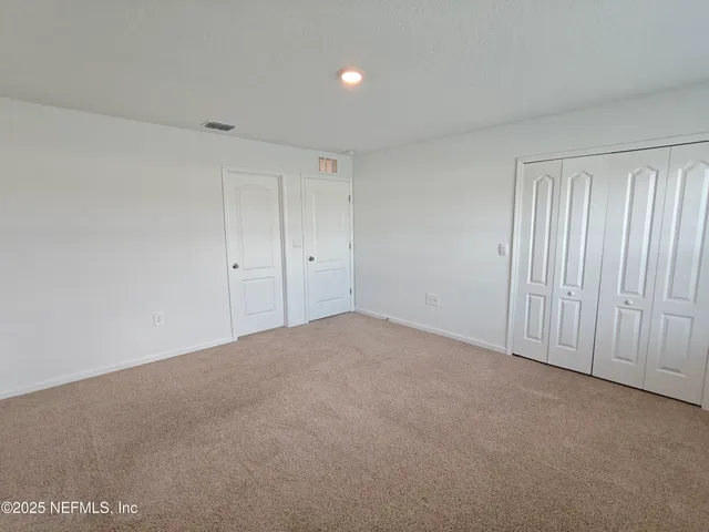 a view of a swimming pool with a yard