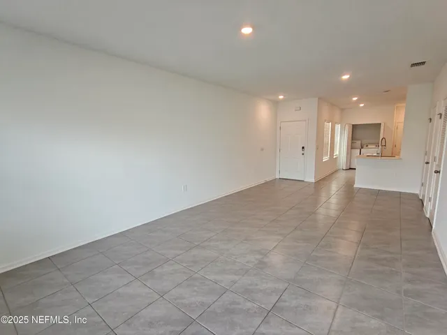 a kitchen with a sink cabinets and utility
