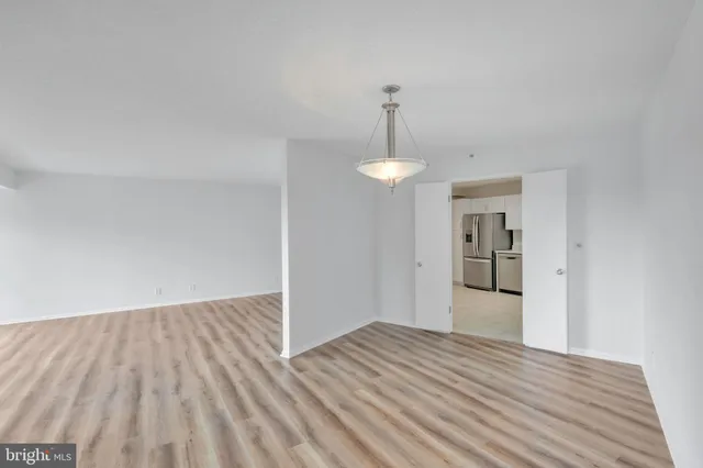 a kitchen with stainless steel appliances granite countertop a refrigerator sink and stove