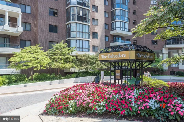 a hall with a large window and sitting area