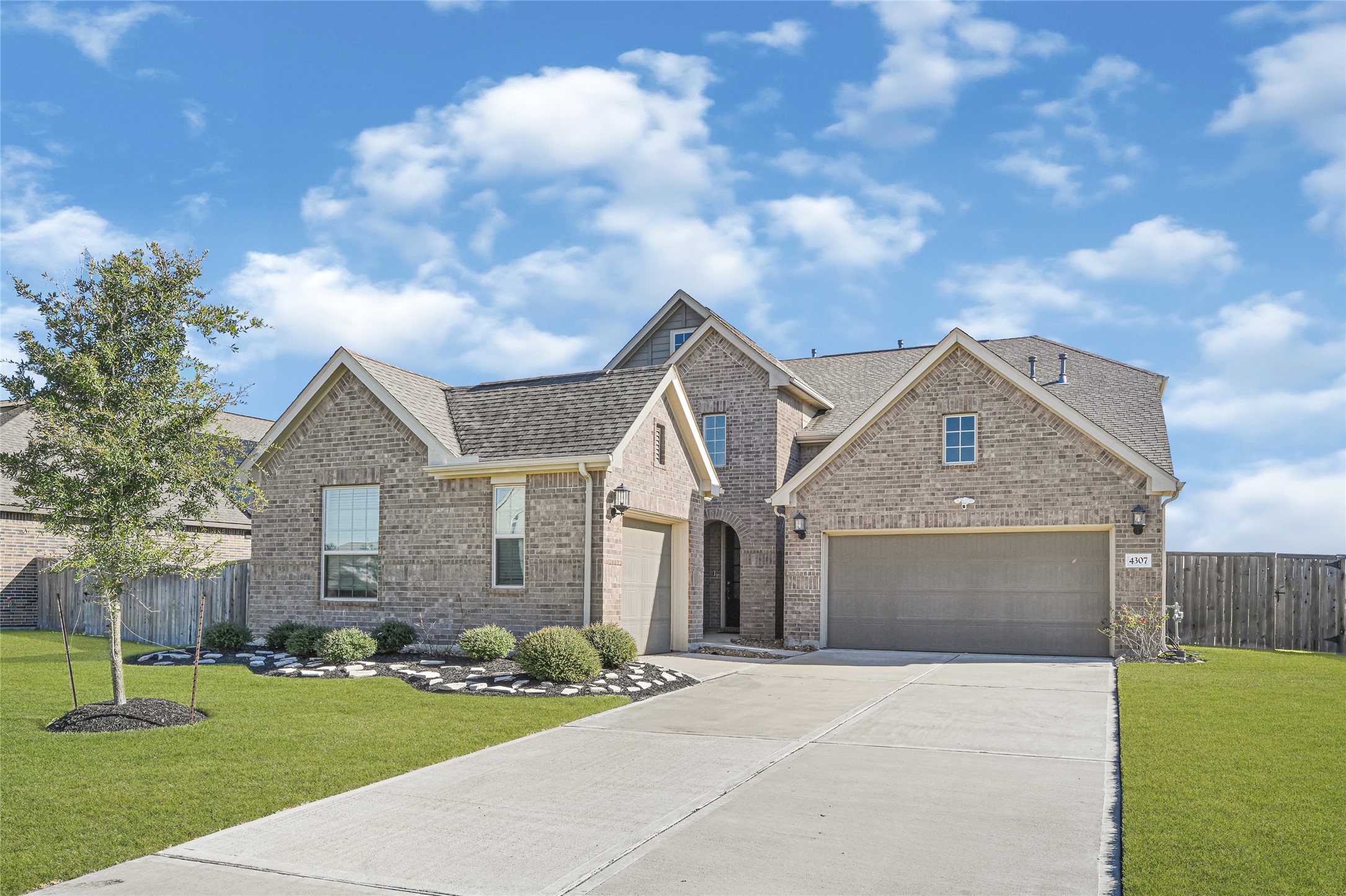 4307 Annandale Lane Rosharon, TX 77583 - Photo 1 of 31 Discover the perfect multi-generational living experience with this spacious home, featuring a main residence with 5 bedrooms and 3.5 bathrooms, plus an attached private suite with its own entrance, bedroom, bathroom, and kitchenette—all set behind a charming facade with both two-car and single-car garages.