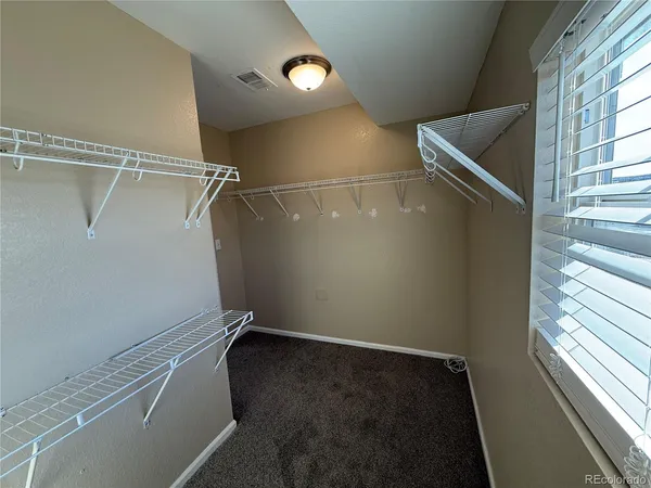 a view of a room with racks on the wall