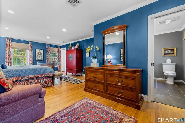 a living room with furniture and a pool table