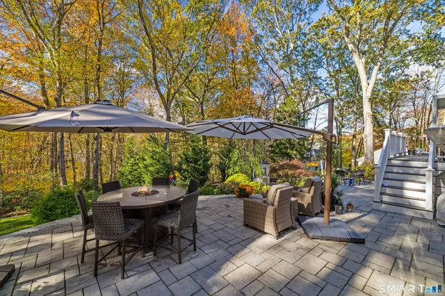 an outdoor space with furniture and umbrella