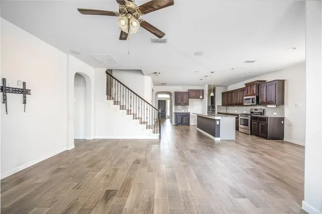 a view of kitchen and wooden floor