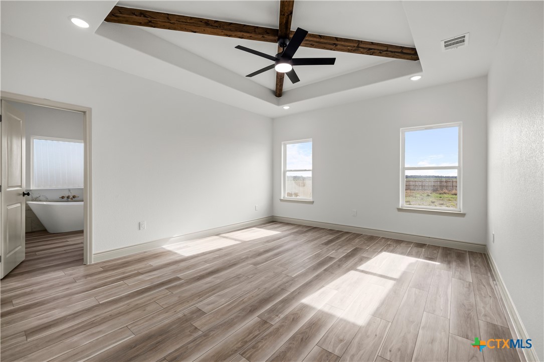 1835 Ember Drive Temple, TX 76502 - Photo 13 of 44 wooden floor in an empty room with a window