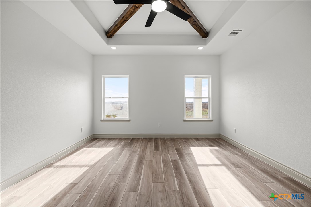 1835 Ember Drive Temple, TX 76502 - Photo 14 of 44 a view of empty room with wooden floor and fan