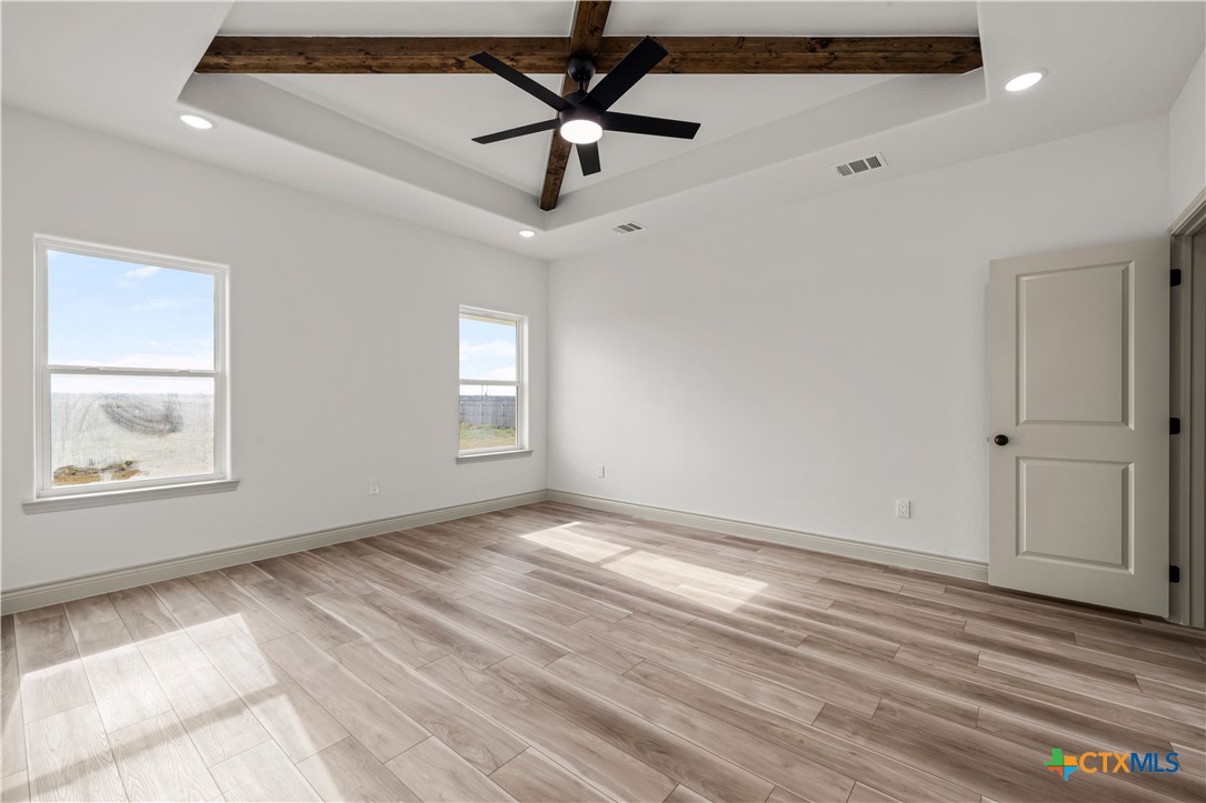 1835 Ember Drive Temple, TX 76502 - Photo 15 of 44 a view of an empty room with window and wooden floor