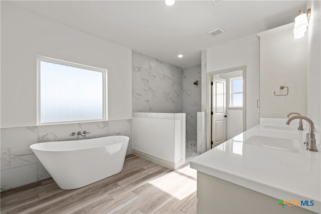 1835 Ember Drive Temple, TX 76502 - Photo 16 of 44 a bathroom with a sink and a mirror