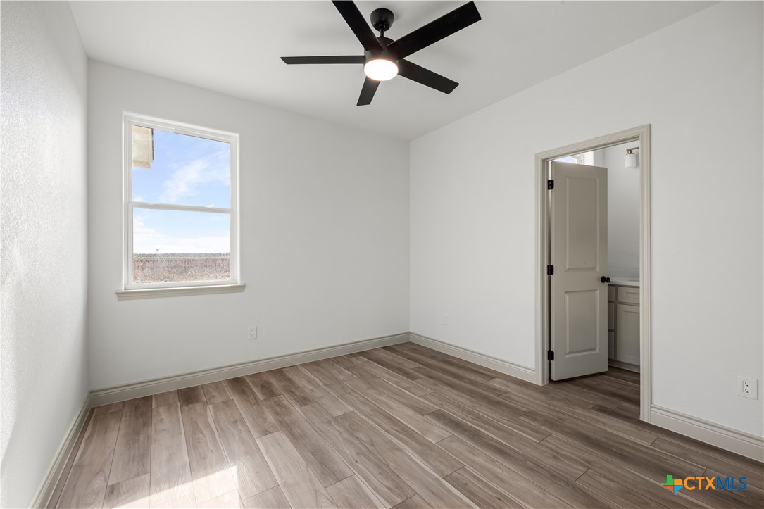 1835 Ember Drive Temple, TX 76502 - Photo 19 of 44 a view of empty room with wooden floor and fan